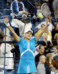 Nadia Petrova of Russia celebrates her 6-3, 6-2 victory over defending champion Justine Henin-Hardenne of Belgium at the US Open 