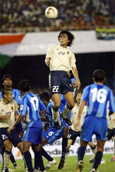 Japan�s Nakazawa Yuji jumps for the ball during the World Cup qualifying match against India in Kolkata on Wednesday. Japan won 4-0. 