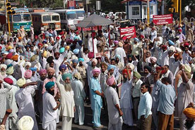 PSEB employees block traffic in Moga on Thursday