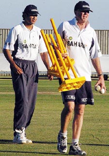 Irfan Pathan and coach John Wright at a practice session in London