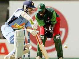 Indian captain Sourav Ganguly plays a shot as Kenya�s wicketkeeper Kennedy Otieno looks on during their opening match of the Champions Trophy in Southampton 
