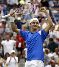 Roger Federer of Switzerland celebrates his victory over Great Britain's Tim Henman