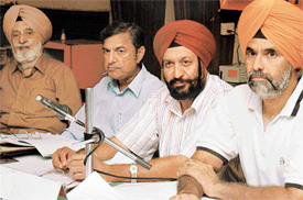 From right to left, Mr Gurjit Singh Lehal, Dr G.S Kochhar, Mr H.C. Sethi and the Golf Club President, Col A.P. Singh, at a press conference at the Chandigarh Golf Club