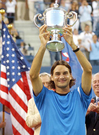 Roger Federer of Switzerland poses with the trophy after defeating Lleyton Hewitt of Australia