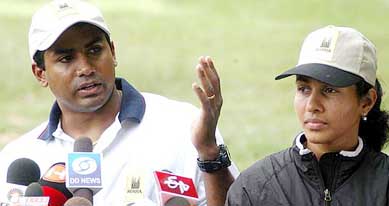 Anju Bobby George with husband and coach Bobby talking to reporters at the Sports Authority of India complex