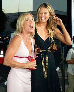 Former champion Chris Evert  shares a laugh as she poses with tennis 2004 Wimbledon women's champion Maria Sharapova during the premiere of the new film "Wimbledon" in Beverly Hills