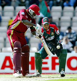 West Indies batsman Wavell Hinds hits out off a ball from Bangladesh bowler Khaled Mahmud