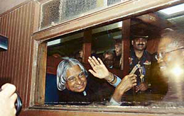 President APJ Abdul Kalam waves at the crowd from a compartment of a vintage train pulled by steam engine at Pietermaritzburg railway station near Durban on Thursday.