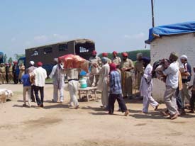 Villagers carry Guru Granth Sahib away from the illegal structure that was demolished by the authorities at Bhagwantpur village in Ropar