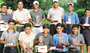 The juniors and subjuniors are all smiles as they pose with their trophies at the Chandigarh Golf Club on Friday. 