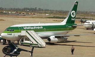 An Iraqi Airways aircraft stands at Baghdad airport after its first flight from Amman on Saturday after a gap of 14 years. The Iraqi Airways flight from Amman to Baghdad was the state airline�s first such flight since 1990 when UN sanctions were imposed on Saddam Hussein�s regime. 