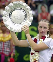Svetlana Kuznetsova of Russia shows her trophy after winning the Wismilak International Tennis Tournament in Bali