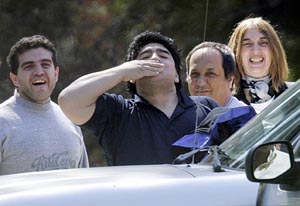 Former Argentine soccer star Diego Maradona blows a kiss to supporters