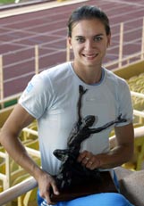 Olympic pole vault champion Yelena Isinbayeva of Russia holds her Athlete of the Year Award in Monaco after the 2nd IAAF World Athletics Final on Sunday. 