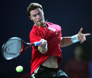 Marat Safin of Russia returns a forehand against compatriot Mikhail Youzhny in the final of the China Open in Beijing on Sunday. Safin won 7-6, 7-5. 