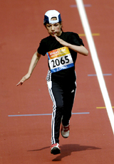 14-year-old Mareena Karim of Afghanistan competes in the women�s 100m-T46 first round race during the 12th Paralympic Games in Athens