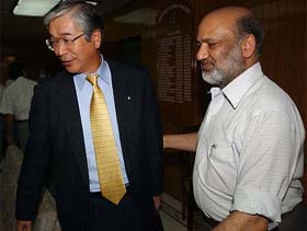 Suzuki delegation chief and Chairman, Maruti Udyog Limited, S. Nakamichi with Heavy Industry Secretary Adarsh Kishore before a meeting at Udyog Bhavan in New Delhi