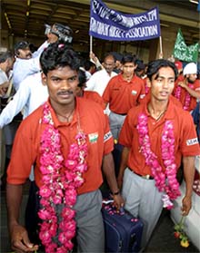 Members of the Indian hockey team arrive at the Karachi airport
