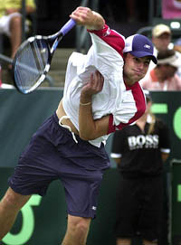 Andy Roddick of the USA serves to Vladimir Voltchkov of Belarus in a Davis Cup semifinal match in Charleston, South Carolina, on Friday. Roddick, who won 6-1, 6-4, 6-4, beat his previous speed record of 153 mph in the match by serving the ball at 155 mph. 