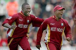 The West Indies� Wavell Hinds (L) celebrates with captain Brian Lara following the dismissal of England�s Andrew Flintoff during their ICC Champions Trophy final at the Oval on Saturday. 