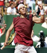 Spain's Rafael Nadal celebrates after winning a point prior his victory over Frenchman Arnaud Clement during their Davis Cup semi-final