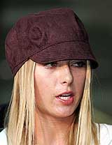 Russia's Wimbledon champion Maria Sharapova answers a reporter's question