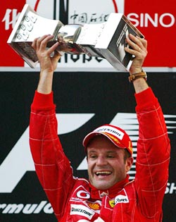 Brazilian Rubens Barrichello of Ferrari celebrates after winning the inaugural Chinese Grand Prix