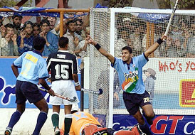 Tushar Khandekar celebrates a goal during the second hockey match between Pakistan 