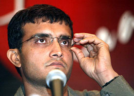 Saurav Ganguly adjusts his glasses as he listens to a question from a reporter