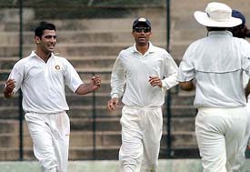 Amit Bandari of India �A� is all smiles after dismissing Akash Chopra of India Seniors during their practice match in Bangalore on Wednesday. 