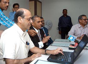 Navin Chawla, Secretary, Ministry of Information and Broadcasting  (left) and K. S. Sarma, CEO, Prasar Bharati (next to him), during the launch of the national commodity exchange ticker service on DD News in New Delhi on Friday. 