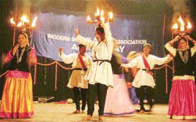 Artistes from Himachal Pradesh dance during the alumni day celebrations