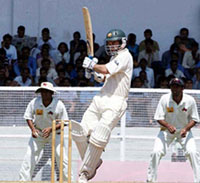 Australia's Justin Langer plays a shot during the third day of the warm-up match against Mumbai