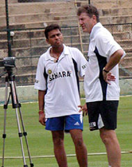 Indian cricket coach John Wright and opener Akash Chopra at the Chinnaswamy Stadium in Bangalore