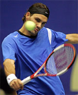 Roger Federer of Switzerland returns a backhand to Paradorn Srichaphan of Thailand during their semifinal match at the Thailand Open in Bangkok on Saturday