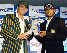 Indian captain Sourav Ganguly and his Australian counterpart Adam Gilchrist pose with the TVS trophy