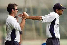 Indian team�s physical trainer Gregory Allen King helps Rahul Dravid with stretching exercises during a training session in Bangalore
