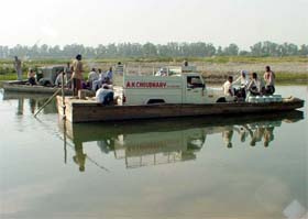 Worn-out boats which are used to ferry men and material across the Ravi at Kathlore Pattan in Gurdaspur district