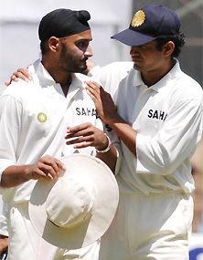 Harbhajan Singh and Irfan Pathan walk off the field during a break