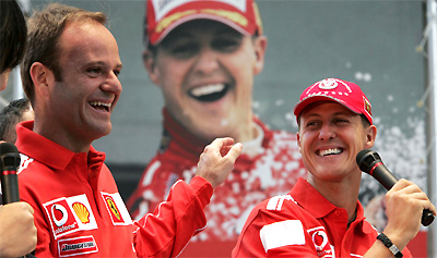 Michael Schumacher and his Ferrari team-mate Rubens Barrichello are all smiles as they join in a question and answer session