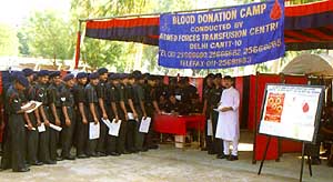 Jawans queue up to donate blood during a blood donation camp in the western sector.