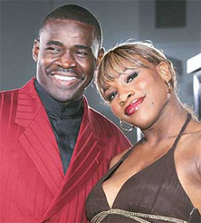 Former Dallas Cowboys football player Michael Irvin and tennis player Serena Williams pose together