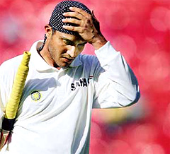 Indian captain Sourav Ganguly reacts as he walks back to the pavillion after being dismissed for 45