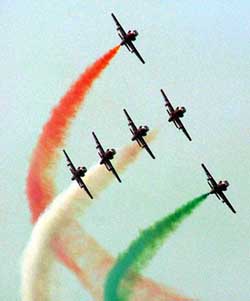 The Indian Air Force team Suryakiran performs during the Air Force Day parade to mark its 72nd anniversary at the Palam Air Force Station in New Delhi