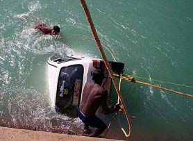 Divers take out a Maruti car from the Bhakra canal near Patiala on Saturday.