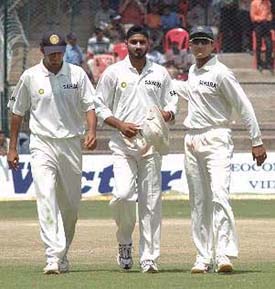 Sourav Ganguly congratulates Harbhajan Singh on taking six wickets during the Australian second innings on the fourth day of the first Test