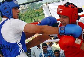 Pratibha  of Panchkula and Rachna of Hisar in action during a boxing bout at the Haryana State Games in Panchkula