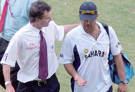 Umpire Billy Bowden offers word of comfort to Virender Sehwag, who was penalised 65 per cent of his match fee for showing dissent in regard to an lbw decision