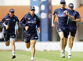 Australian players run during a training session in Chennai