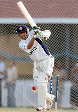 Indian cricketer Mohammad Kaif practices at the net
